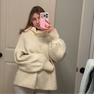 Free People “Milo” oversized turtleneck sweater